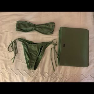 Triangl swimwear set. Brand new. Never worn. Size small top and medium bottoms.